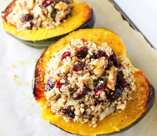 This Roasted Acorn Squash with Cranberry Walnut Quinoa Stuffing is a crowd favorite, it is also Vegan and Gluten Free! | Tastefulventure.com