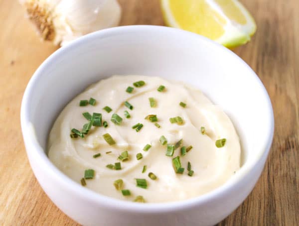 This 5 Minute Garlic Aioli is the perfect sauce for any seafood, we used it on a Salmon Dill Parmesan Burger...so delicious! Plus we made it Dairy Free! | Tastefulventure.com
