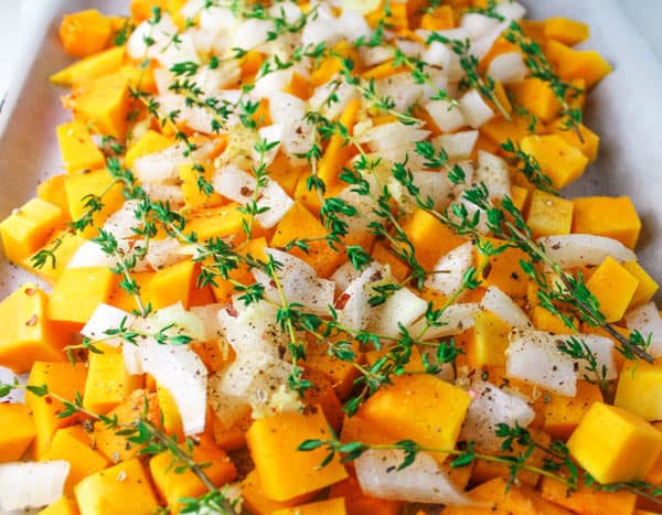 Baked Butternut Squash, a simple healthy side dish. You can make this ahead of time and then add to a crockpot on low heat for a crowd pleasing favorite! | Tastefulventure.com