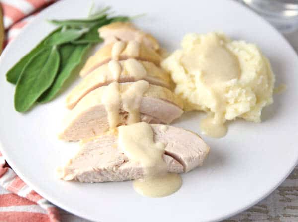 Slow Cooker Turkey Breast With White Wine Gravy and mash potatoes