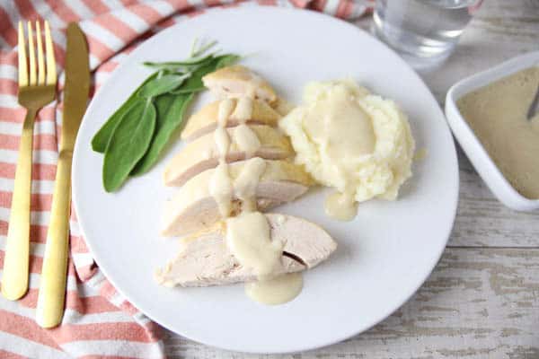 Slow Cooker Turkey Breast With White Wine Gravy on a plate