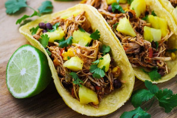 These Slow Cooker Hawaiian Chicken Tacos are a crowd favorite! | Tastefulventure.com