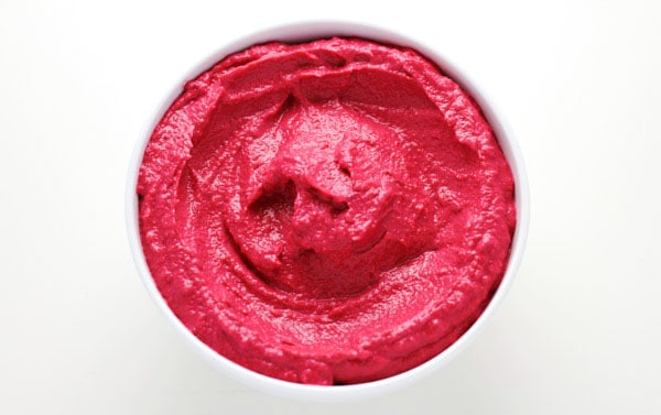 Creamy Beet Hummus made with simple fresh ingredients and has such an amazing flavor! This is a crowd favorite at our house! | Tastefulventure.com