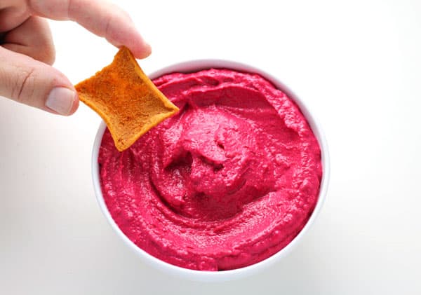 Creamy Beet Hummus made with simple fresh ingredients and has such an amazing flavor! This is a crowd favorite at our house! | Tastefulventure.com