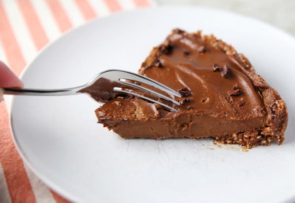 This Chocolate Avocado Pie with a Cashew Crust is so creamy and delicious! You honestly can't even taste the Avocado, it tastes so incredibly chocolaty! #glutenfree #dessert #chocolate #avocado #pie #vegetarian